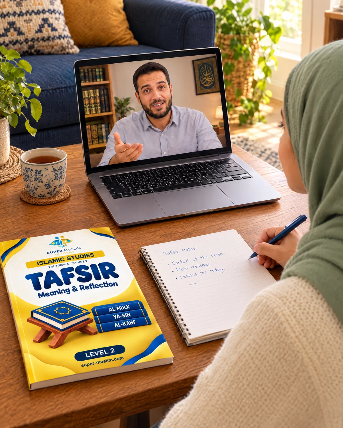 Girl taking Tafsir notes while her Egyptian online teacher explains a verse on the laptop, with the Super Muslim Tafsir Level 2 book on the table